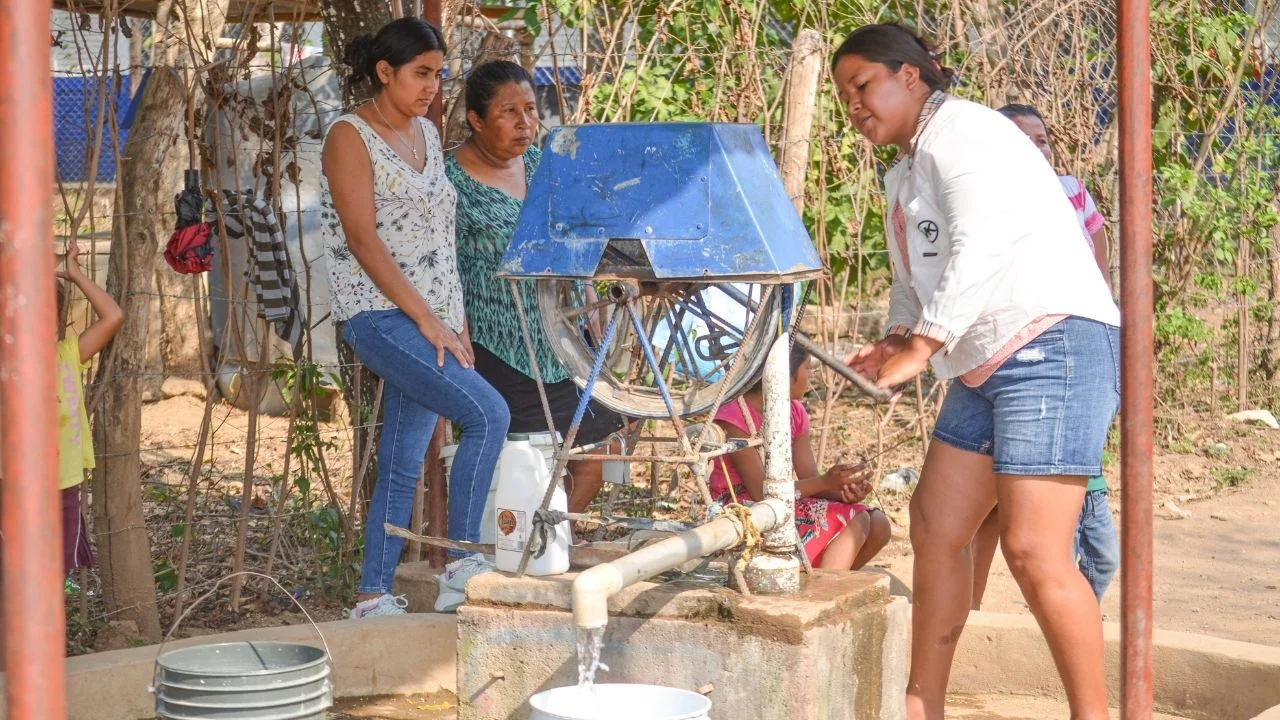 Children at the school rainwater harvesting system